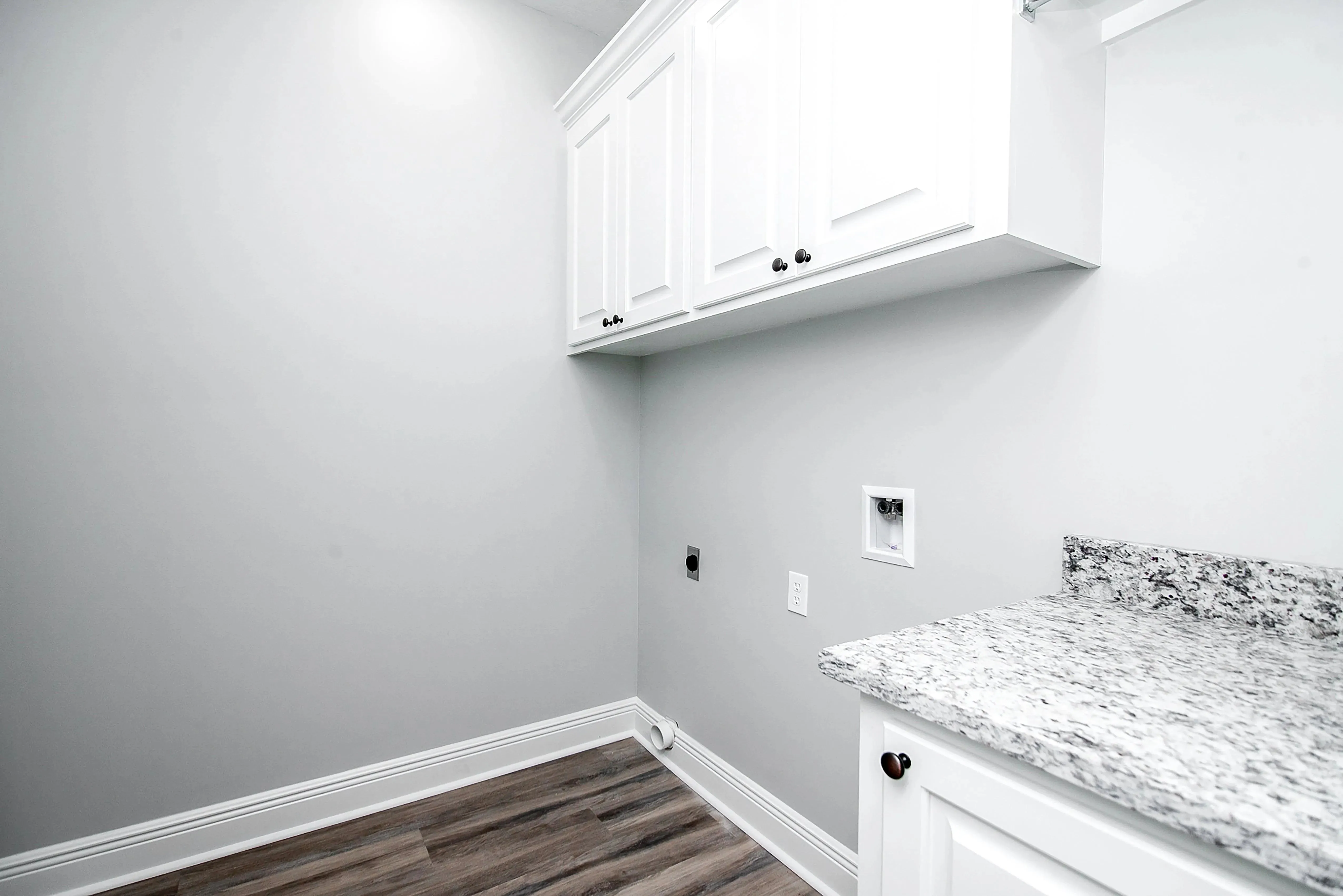 Charming 4-Bedroom Home Plan with Front Garage and Inviting Porch