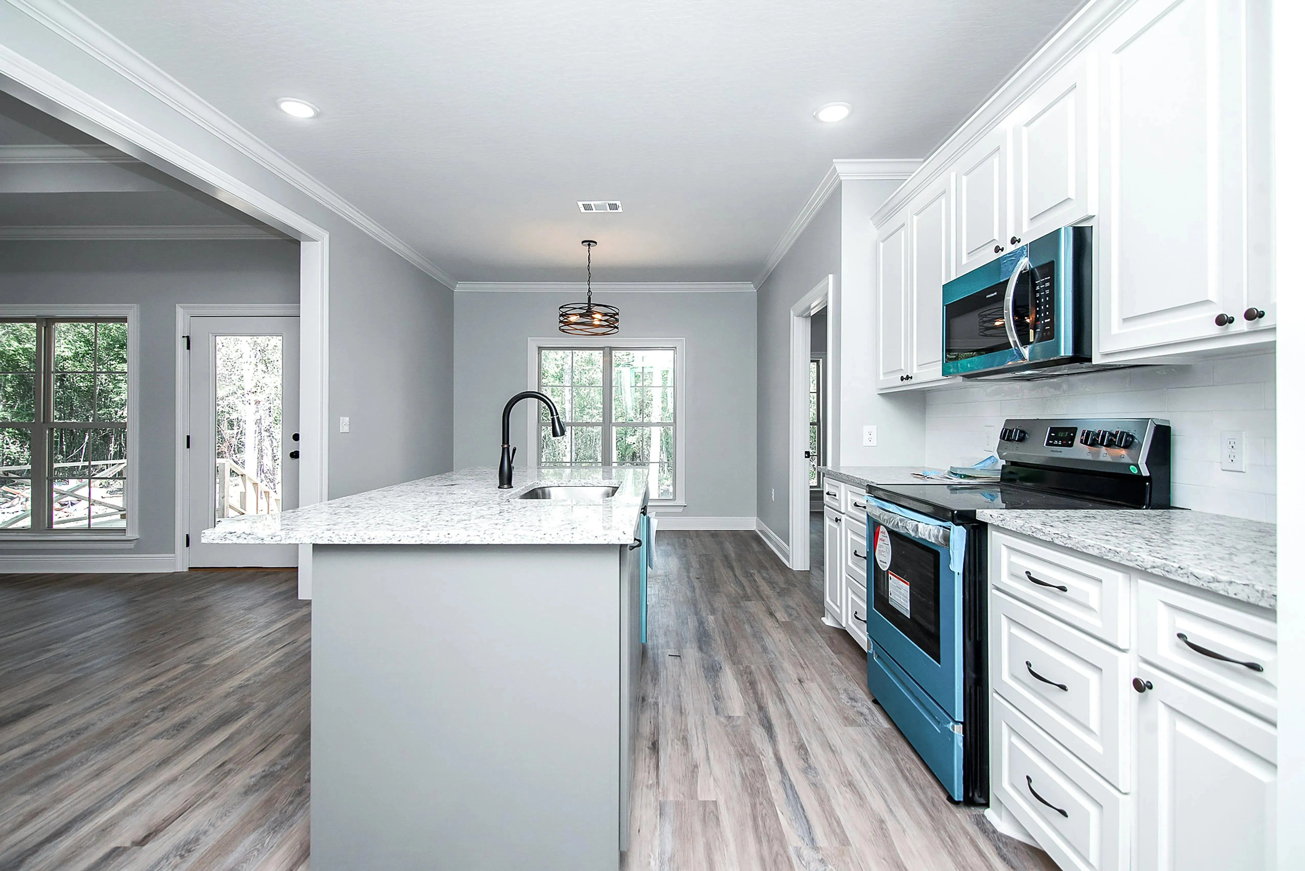 Charming 4-Bedroom Home Plan with Front Garage and Inviting Porch