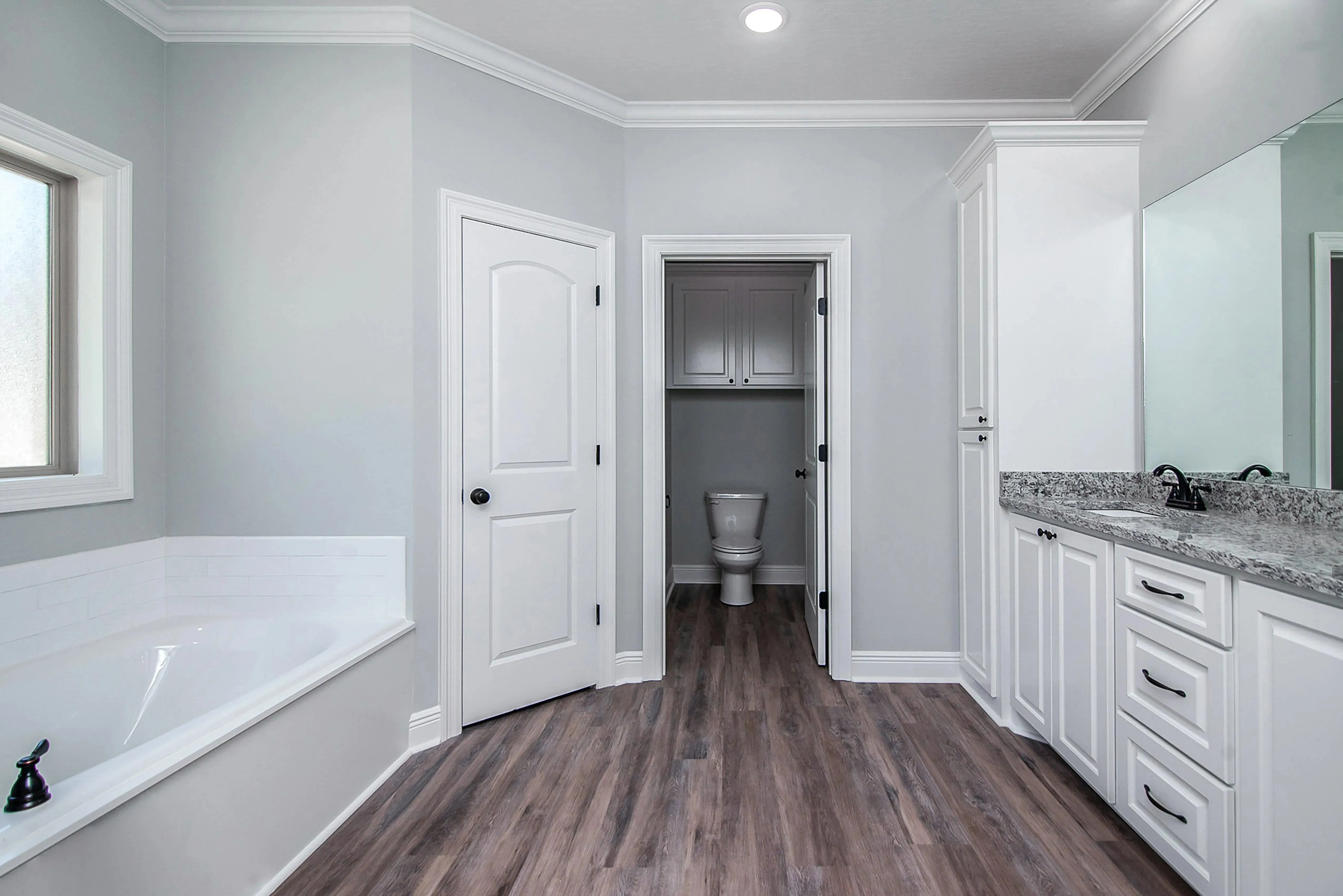 Charming 4-Bedroom Home Plan with Front Garage and Inviting Porch