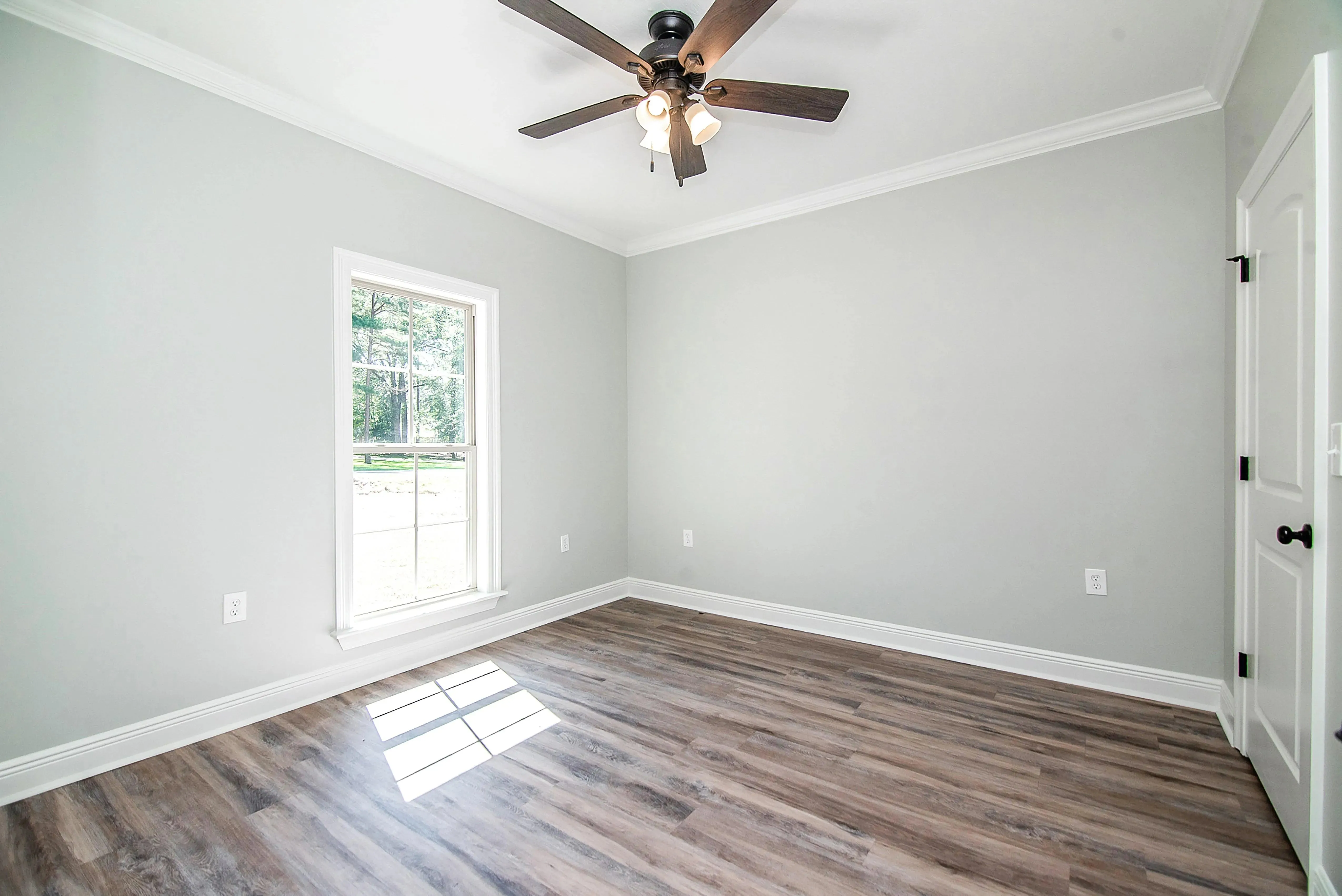 Charming 4-Bedroom Home Plan with Front Garage and Inviting Porch