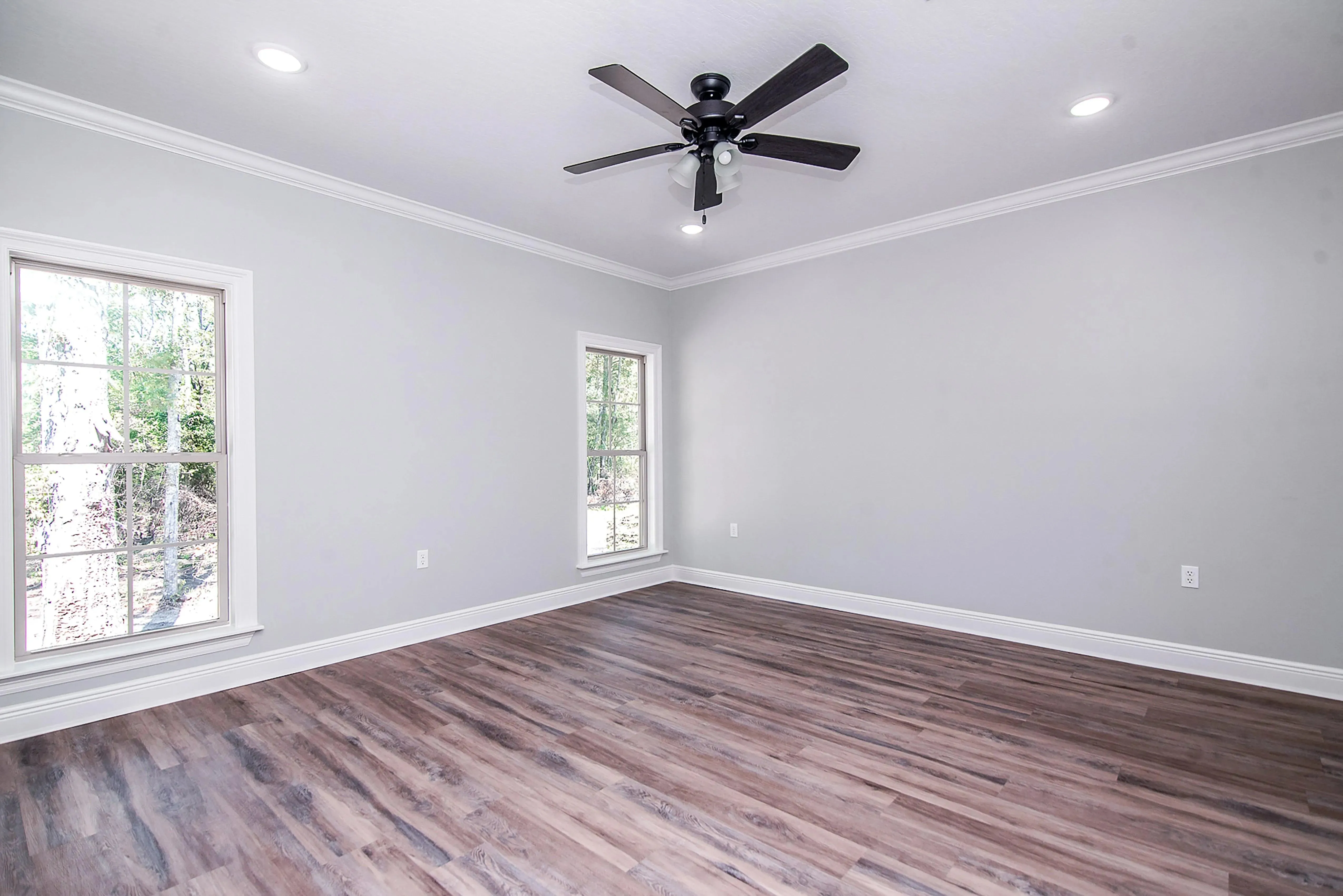 Charming 4-Bedroom Home Plan with Front Garage and Inviting Porch