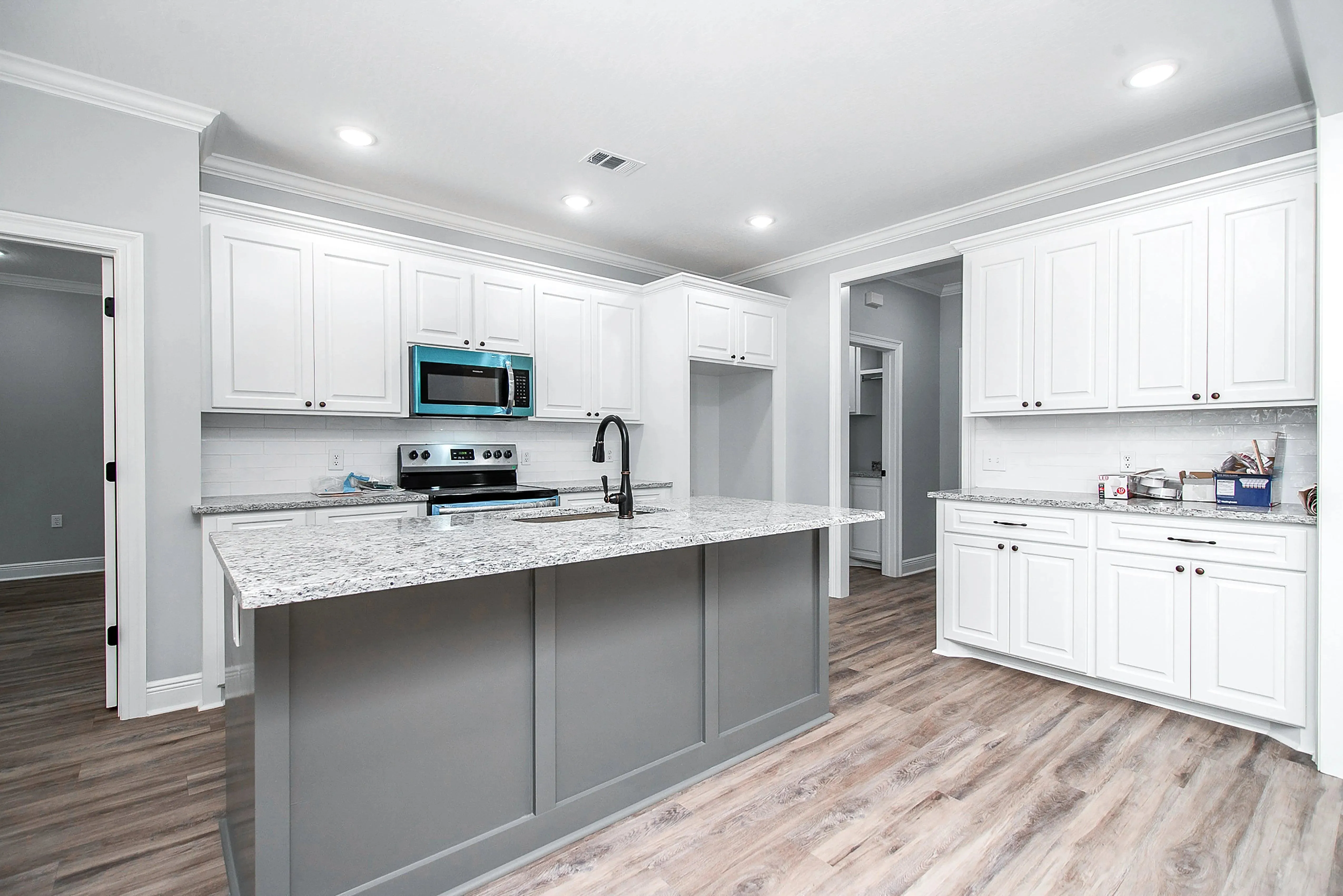 Charming 4-Bedroom Home Plan with Front Garage and Inviting Porch