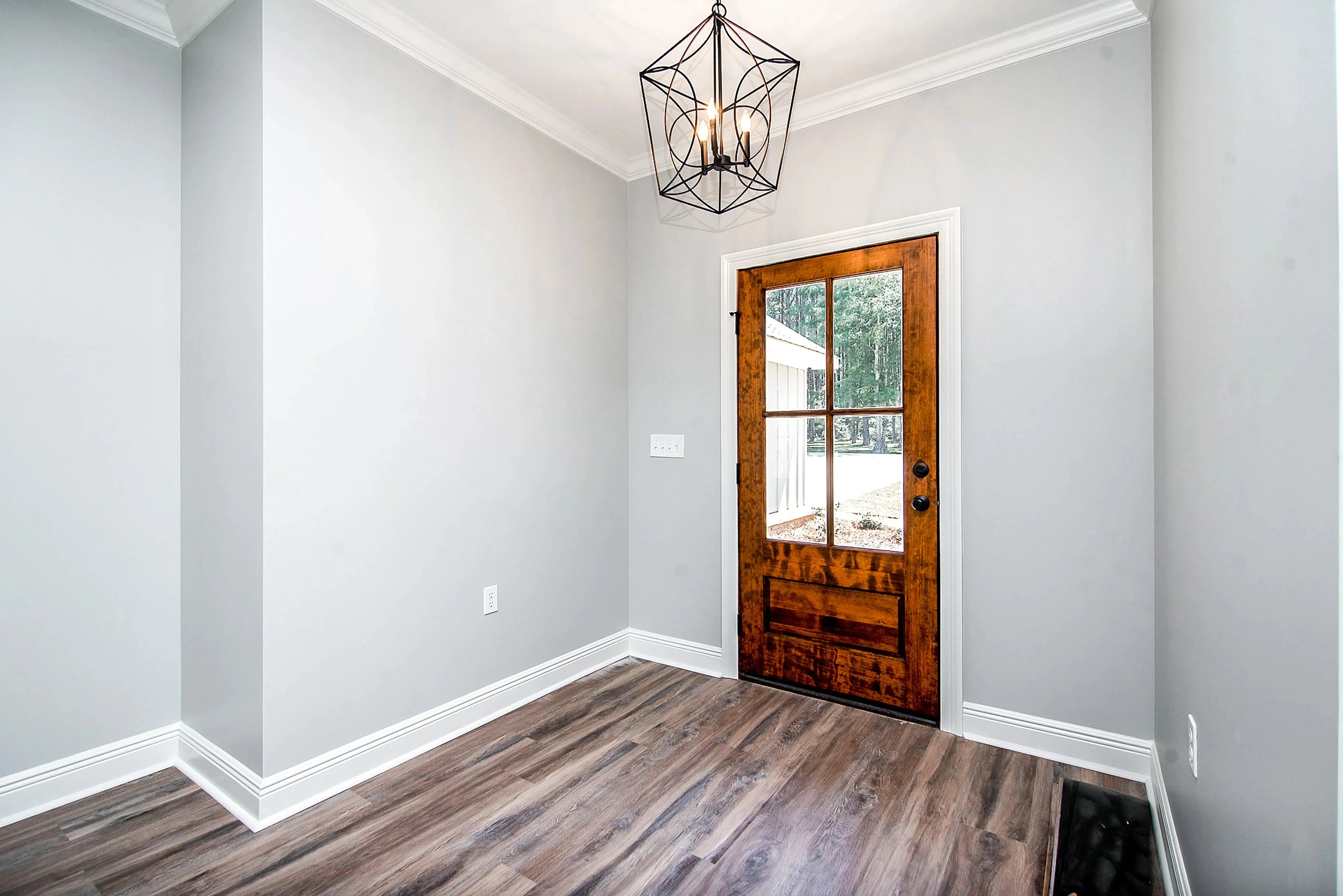 Charming 4-Bedroom Home Plan with Front Garage and Inviting Porch