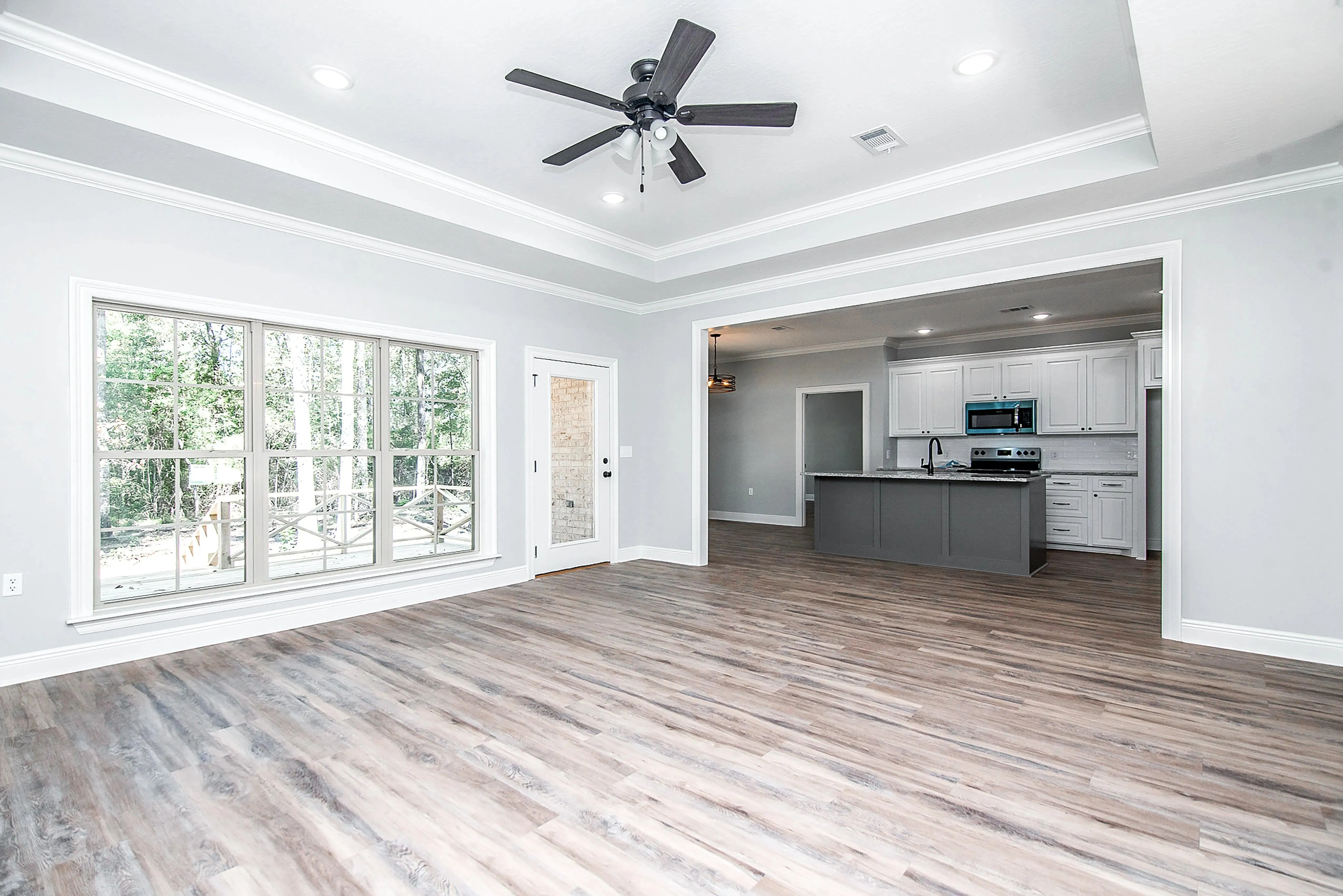Charming 4-Bedroom Home Plan with Front Garage and Inviting Porch