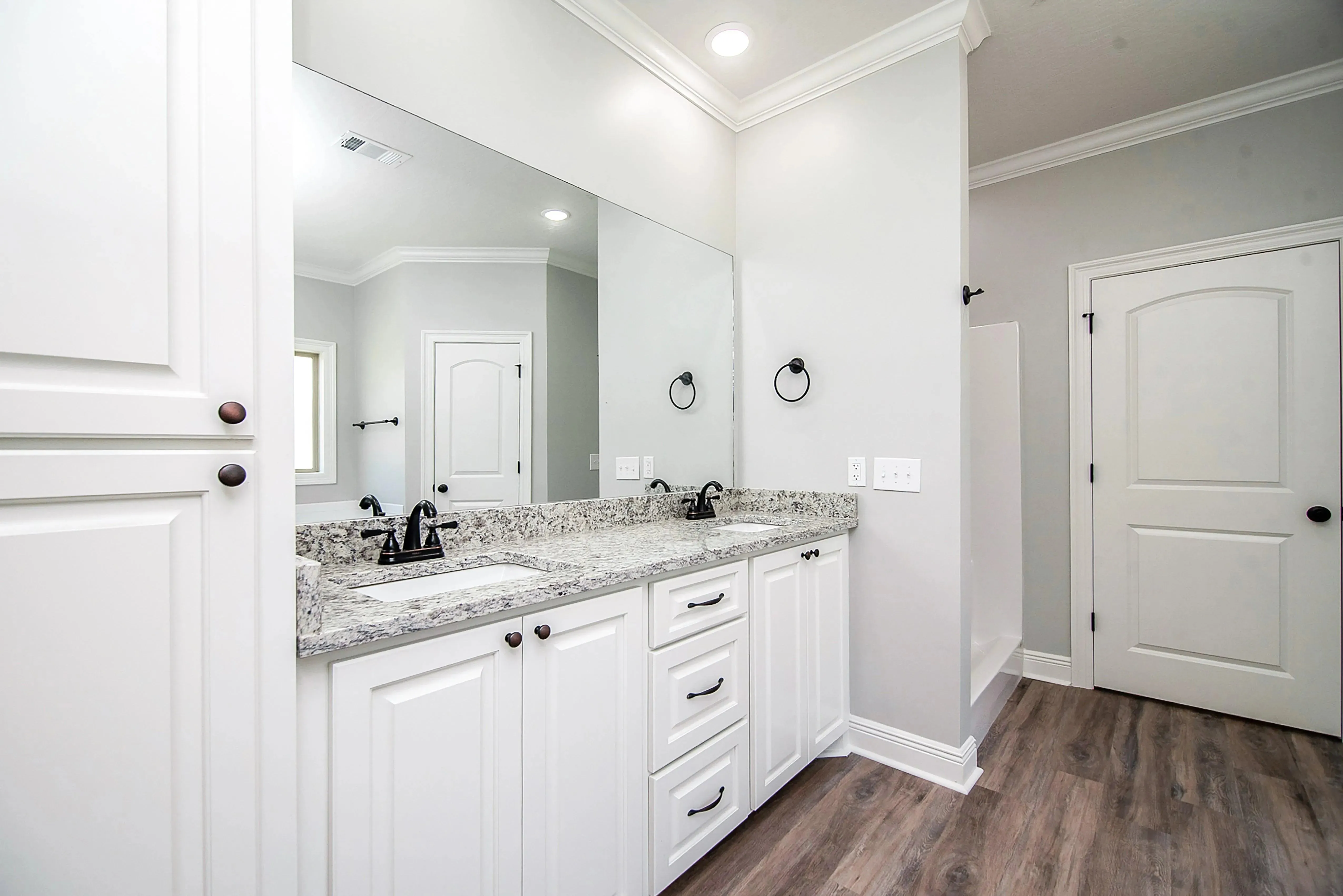Charming 4-Bedroom Home Plan with Front Garage and Inviting Porch