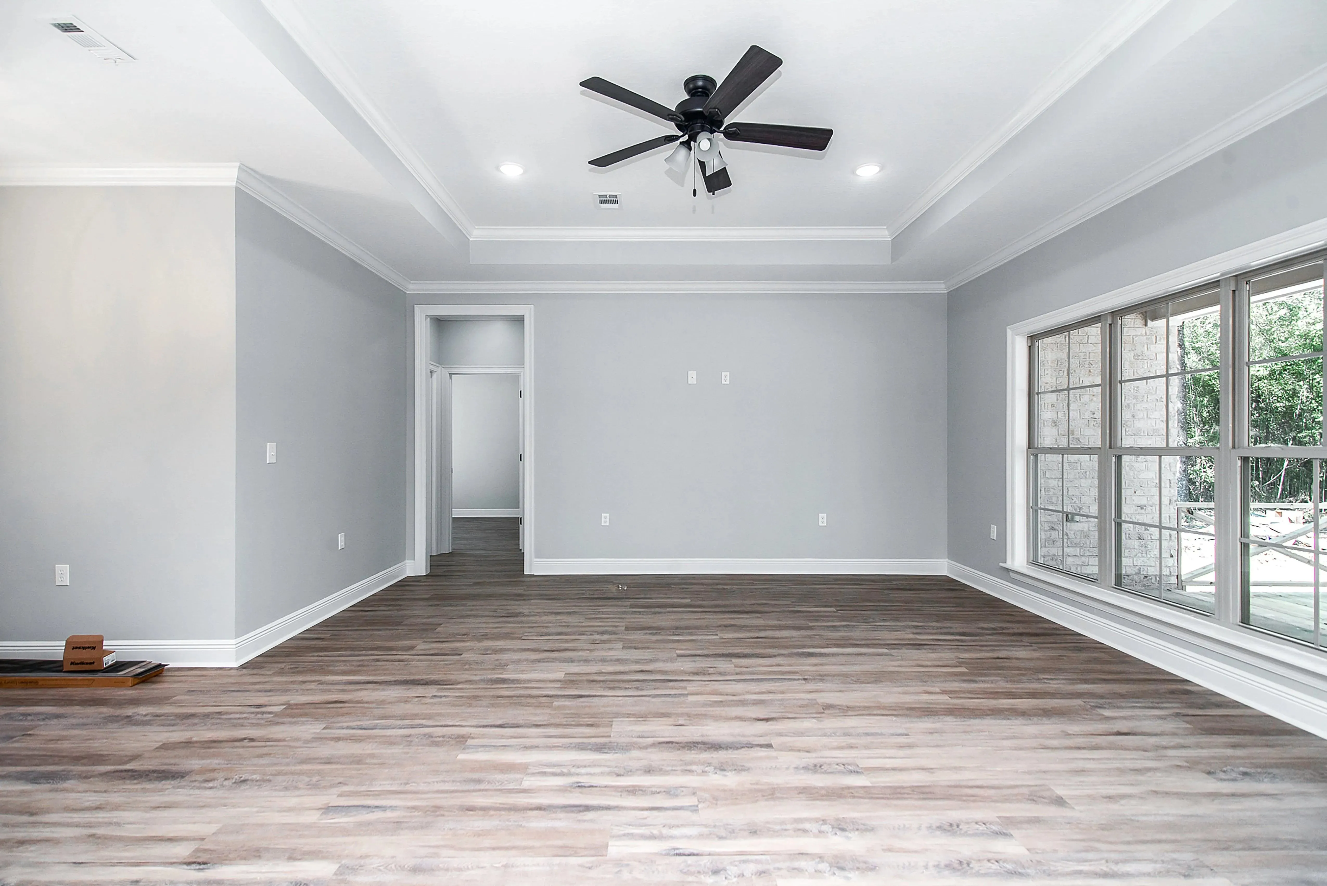 Charming 4-Bedroom Home Plan with Front Garage and Inviting Porch