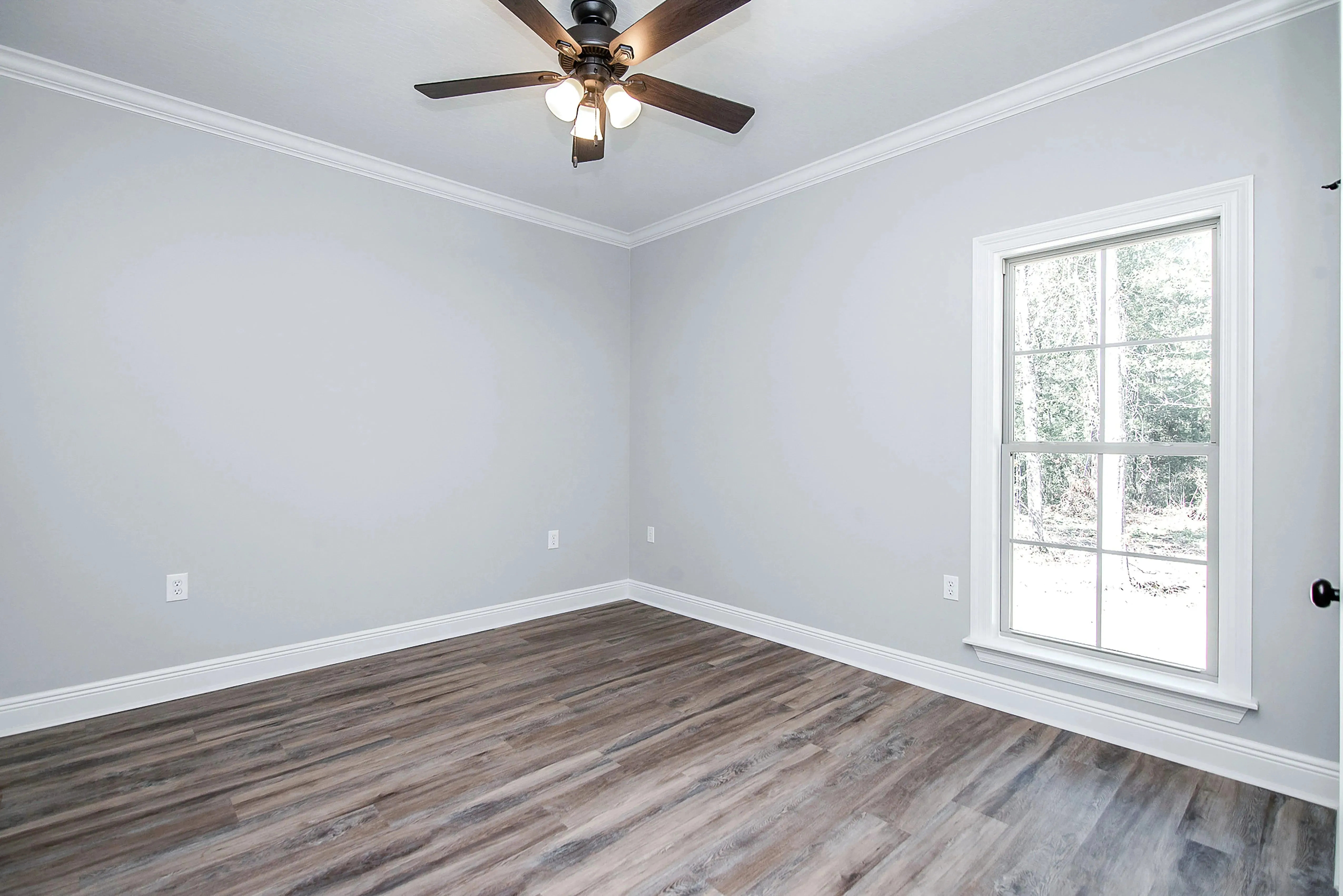 Charming 4-Bedroom Home Plan with Front Garage and Inviting Porch