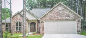 Charming 4-Bedroom Home Plan with Front Garage and Inviting Porch