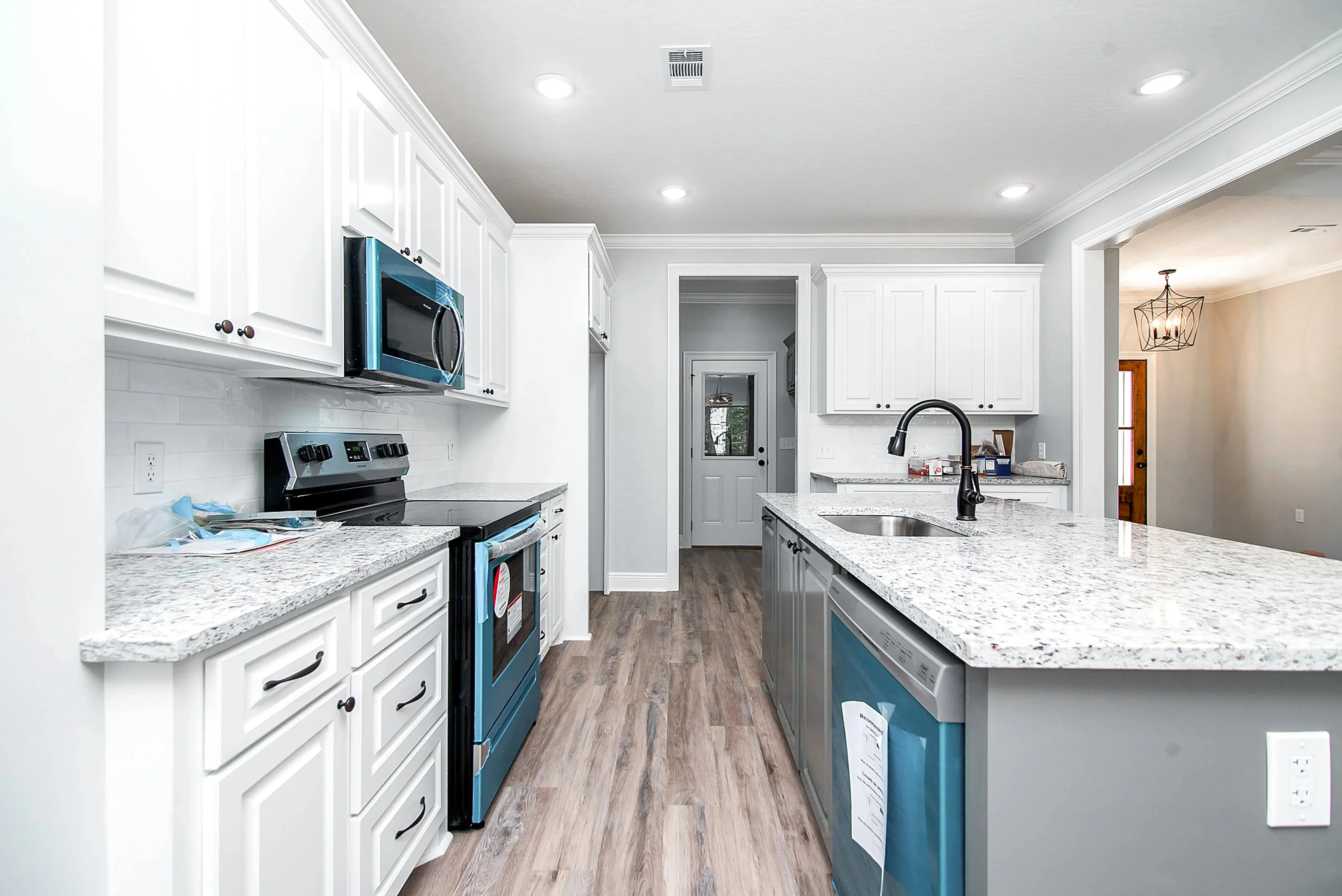Charming 4-Bedroom Home Plan with Front Garage and Inviting Porch