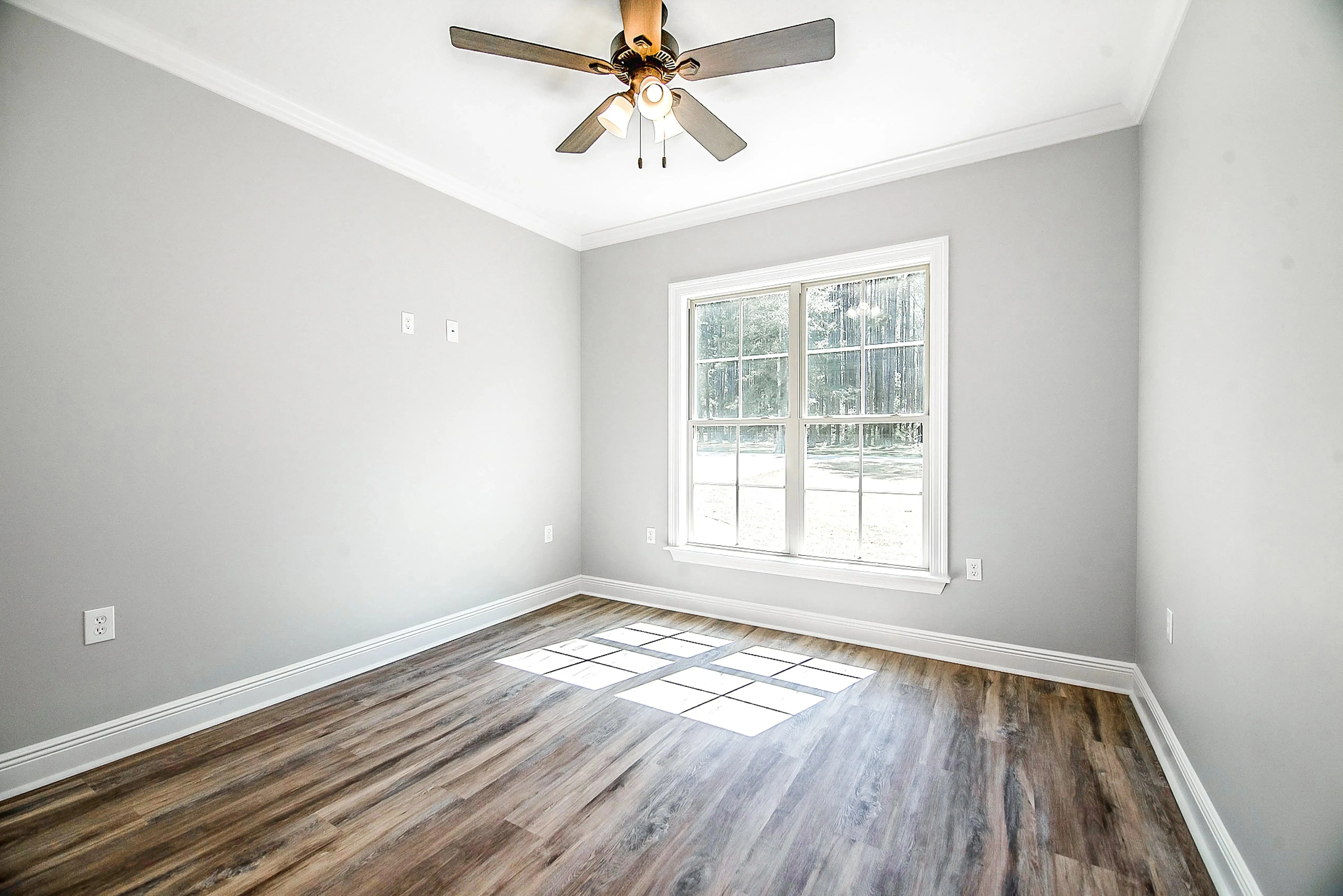 Charming 4-Bedroom Home Plan with Front Garage and Inviting Porch