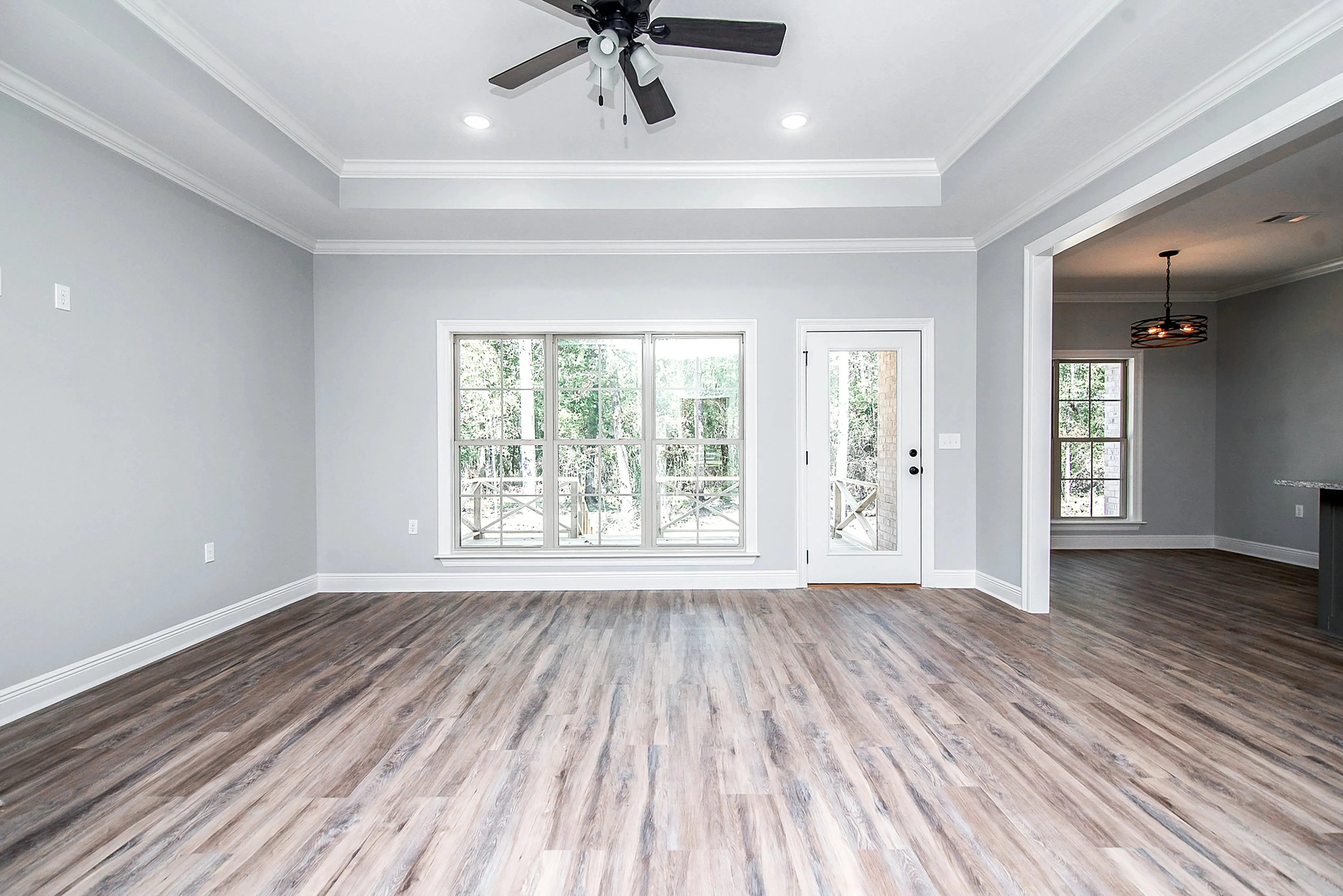 Charming 4-Bedroom Home Plan with Front Garage and Inviting Porch