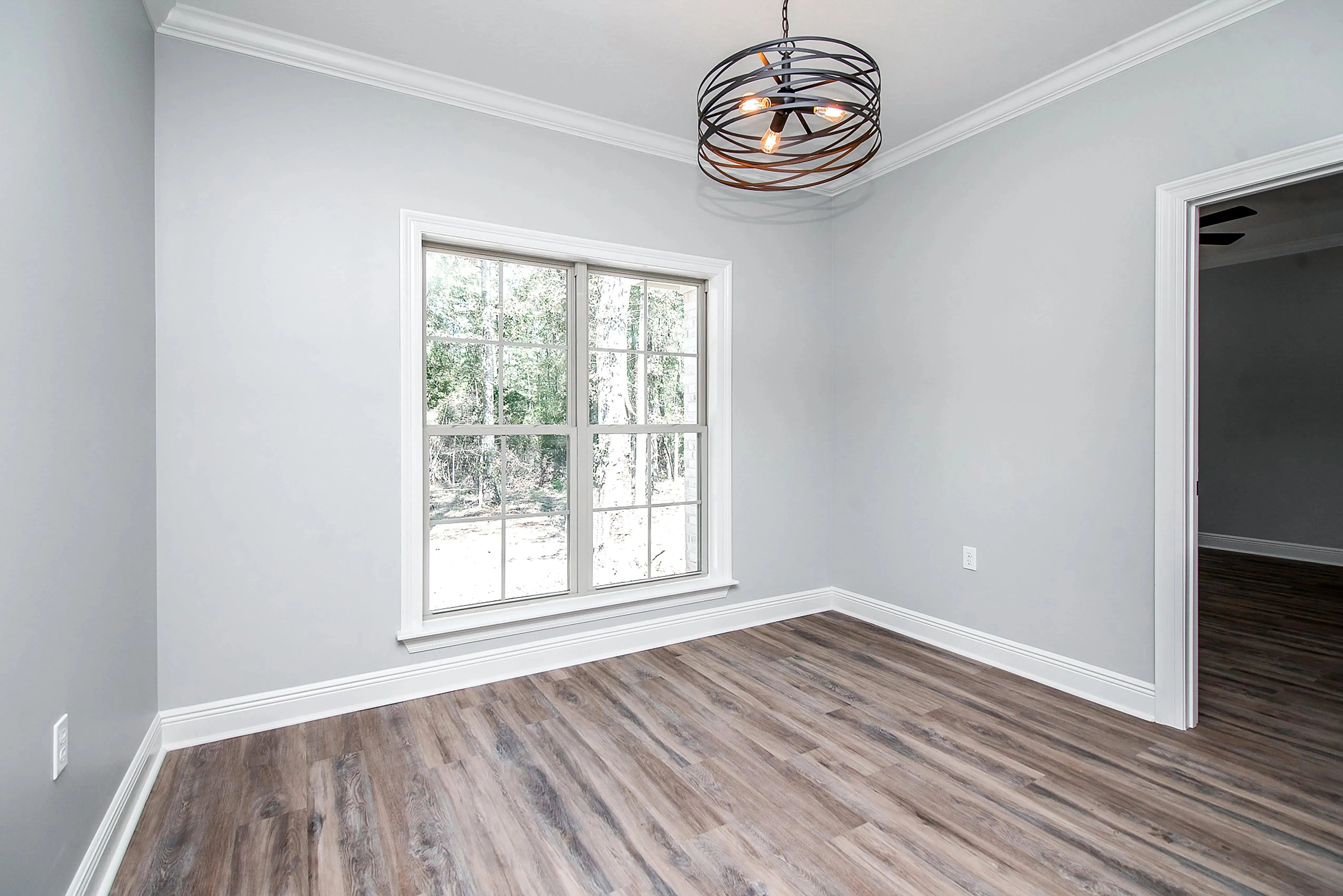 Charming 4-Bedroom Home Plan with Front Garage and Inviting Porch