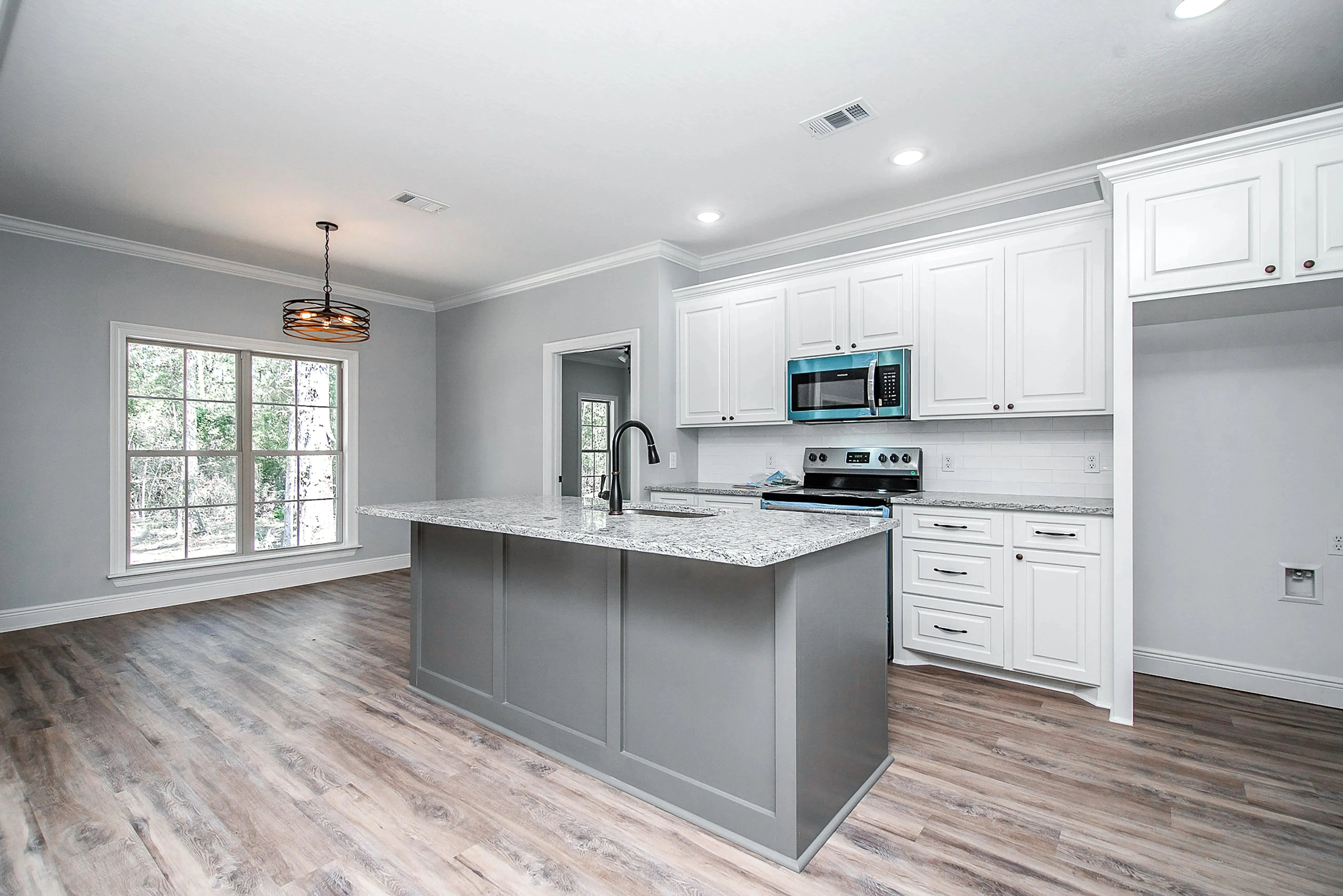 Charming 4-Bedroom Home Plan with Front Garage and Inviting Porch